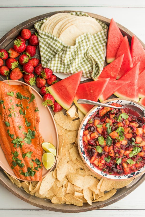 a round salmon taco dinner board