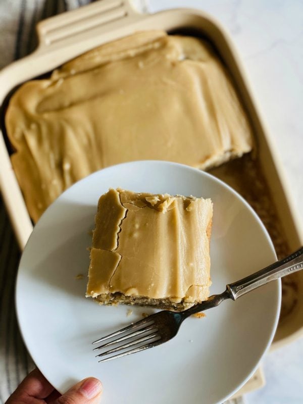 a piece of banana zucchini cake with maple frosting