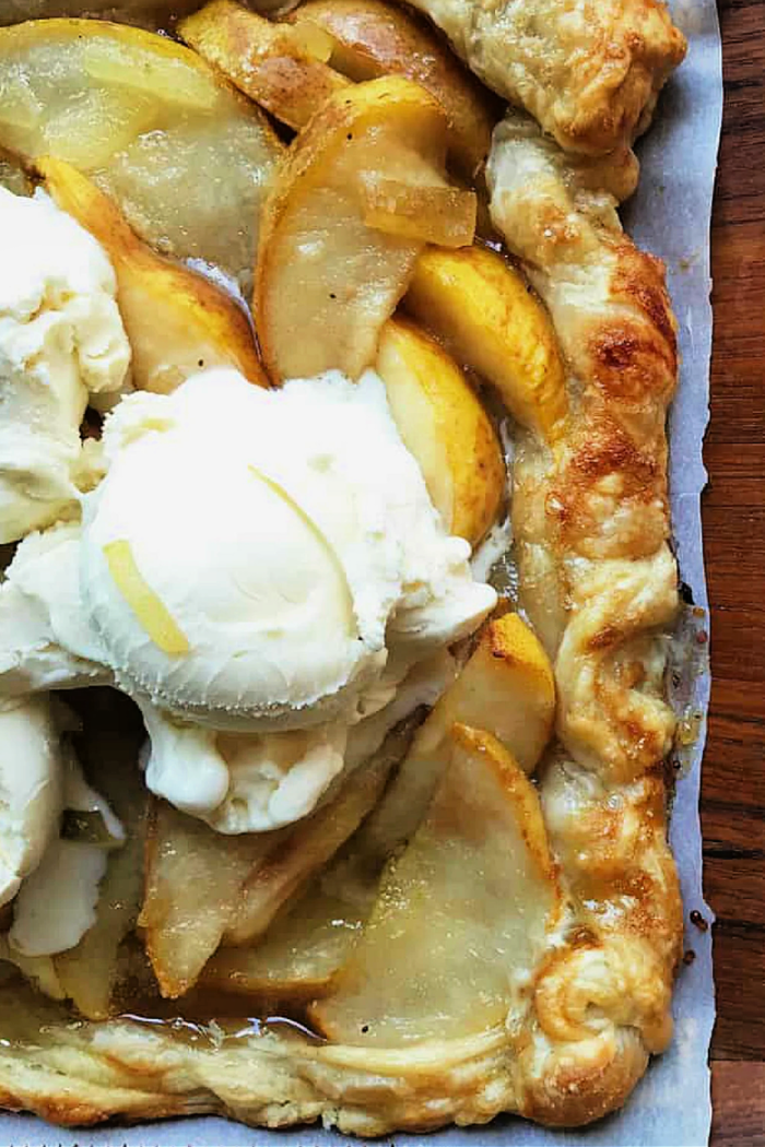 a pear tart made with puff pastry served with ice cream