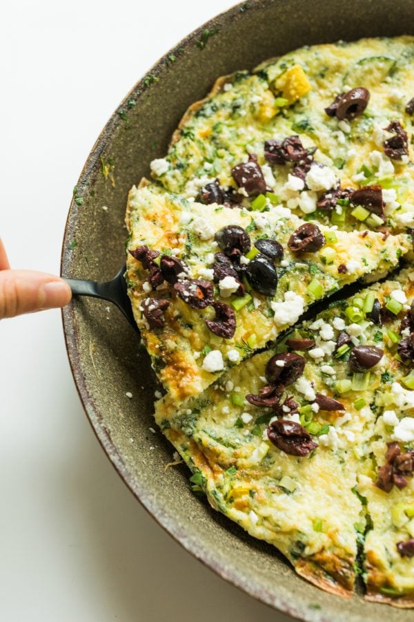 a piece of Easy Zucchini Frittata Recipe in a skillet