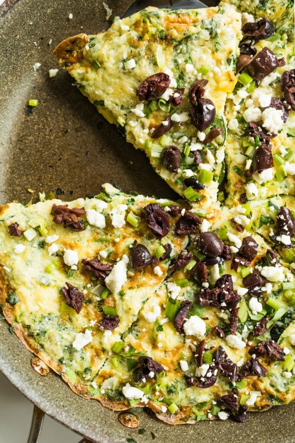 a round Zucchini Frittata with Kalamata olives