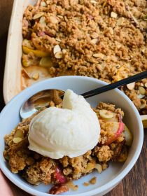 scoop of vanilla gelato on a bowl of Apple Pear Crumble