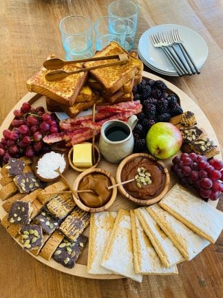 round wood breakfast tray with french toast
