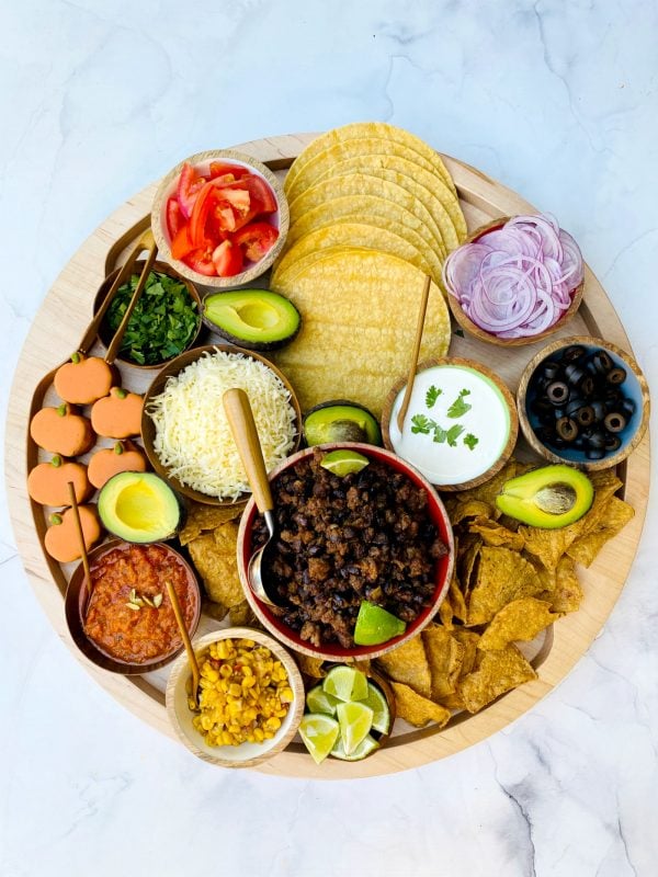 a pumpkin spice taco board with all the toppings