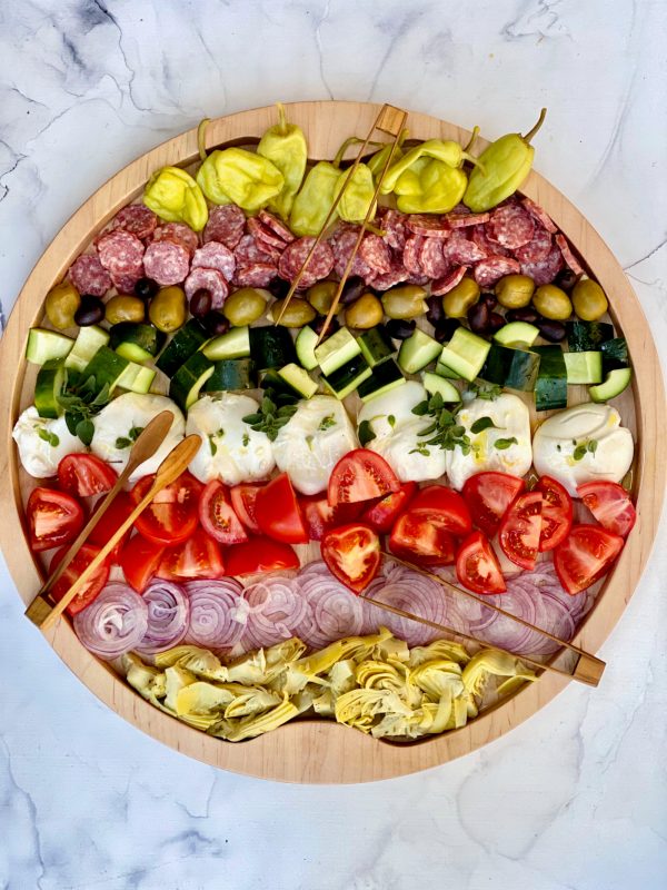 Burrata Chopped Salad Board served with tongs on wood board