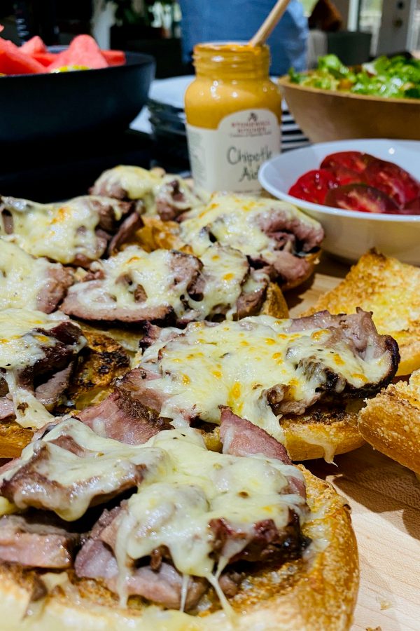 cheese melted on open face steak sandwiches