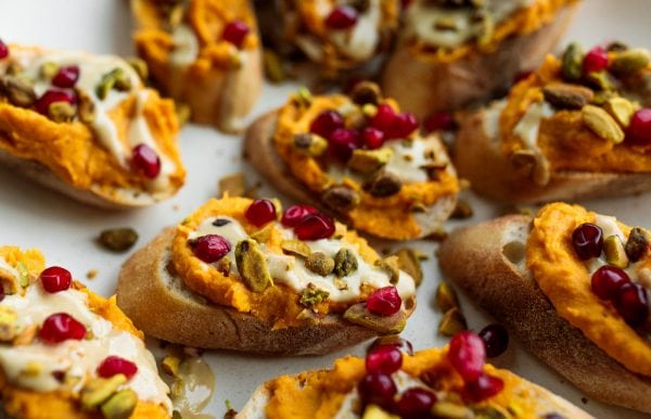 festive Sweet Potato Garlic Crostini on a plate