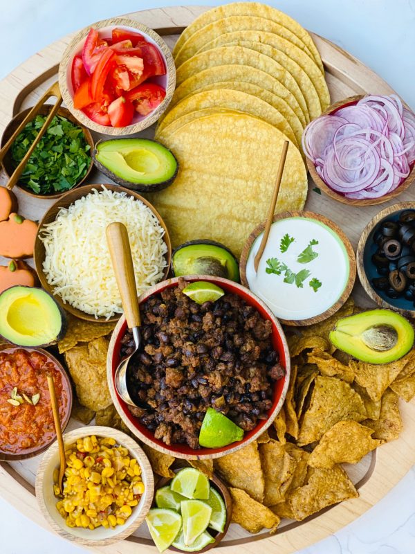 spiced pumpkin taco meat with tortillas and other taco ingredients