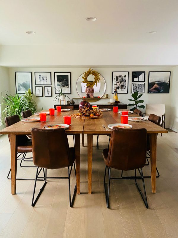 square table set with orange glasses