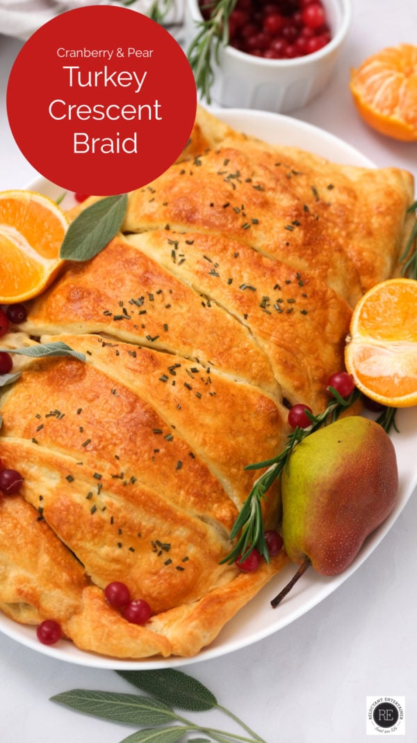 Cranberry Pear Turkey Crescent Braid on a serving plate garnished