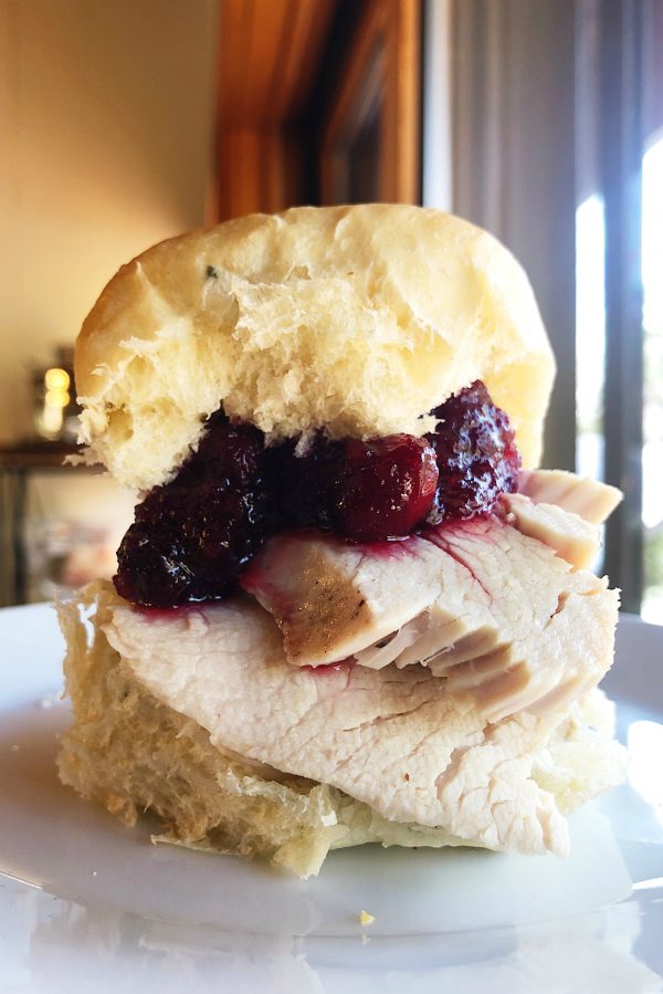 turkey on a roll with cranberry sauce