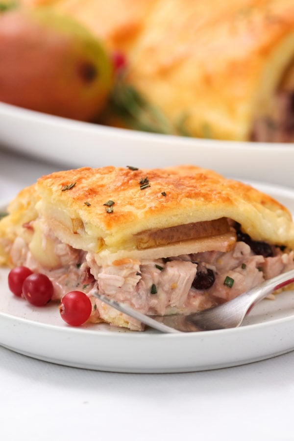 a piece of Cranberry Pear Turkey Crescent Braid with a fork