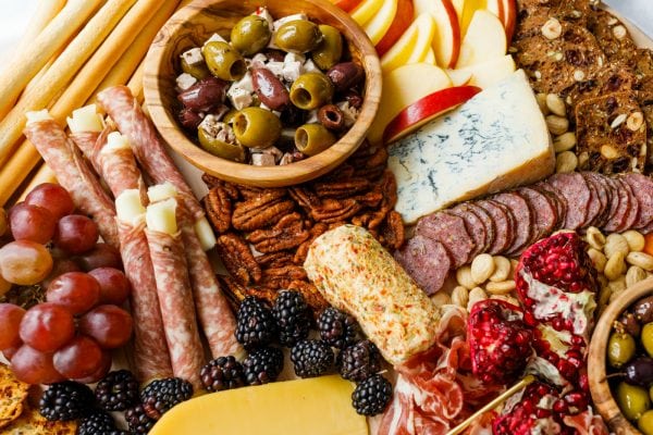 olives, meat, cheese, on a winter board