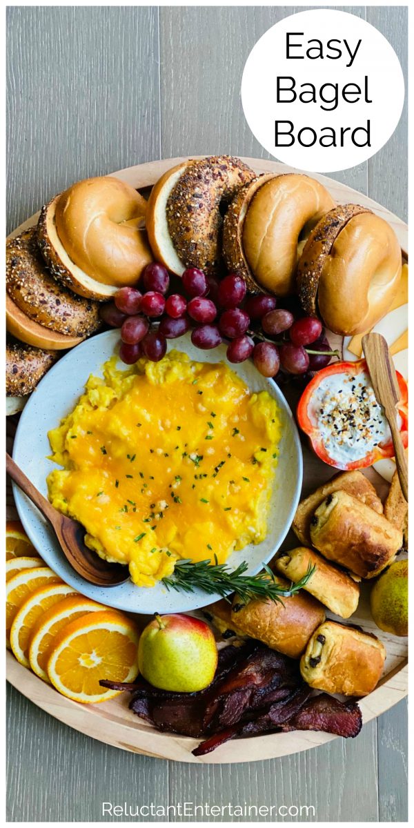 an bagel board with eggs, meat, cheese