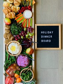 holiday dinner board with ham and potatoes