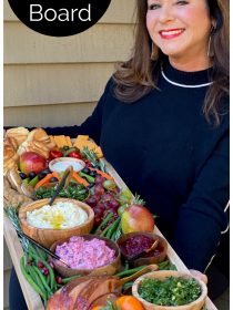 woman holding a holiday ham dinner board