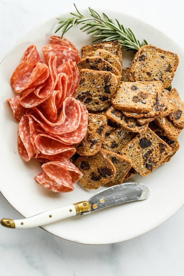 salami and crackers on a plate