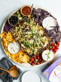 nacho board with chips and toppings