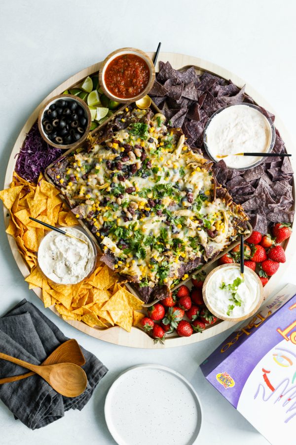 nacho board with chips and toppings