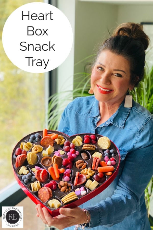 woman holding a Heart Box Snack Tray