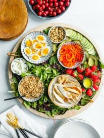 Chicken Farro Salad Board on a round board with serving dishes