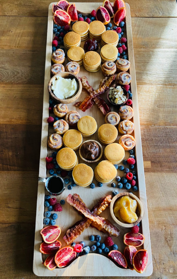 board with silver dollar pancakes and bacon