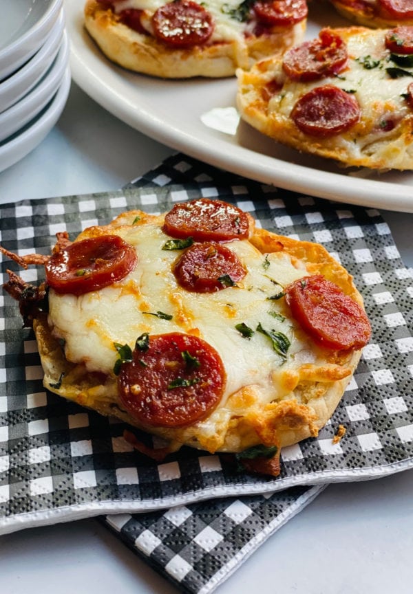 Engliish Muffin Pepperoni Pizza on a black and white checked napkin