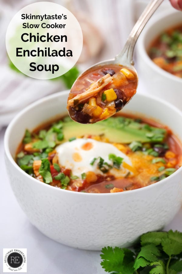 taking a bite of Slow Cooker Chicken Enchilada Soup