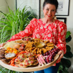 woman holding a Epic Ultimate Game Day Tray