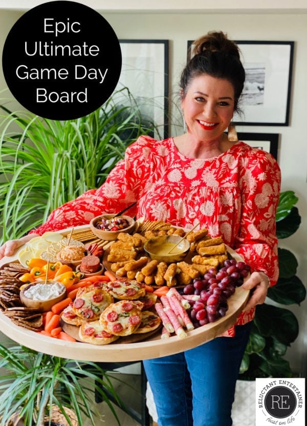 woman holding an Epic Ultimate Game Day Board for a party
