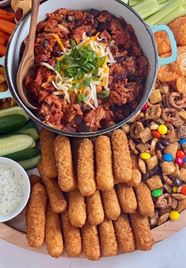 pot of chili with game day snacks