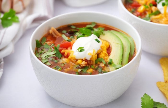 bowl of enchilada soup with sour cream
