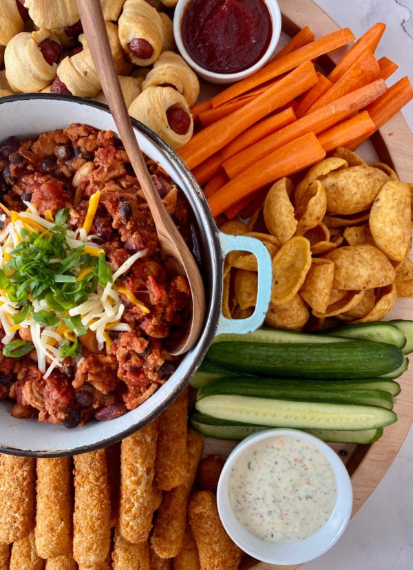 pot of chili with cheese, with other snacks