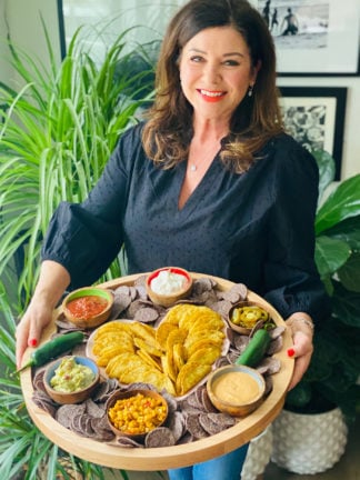 woman holding a Chicken Taco Dipping Board