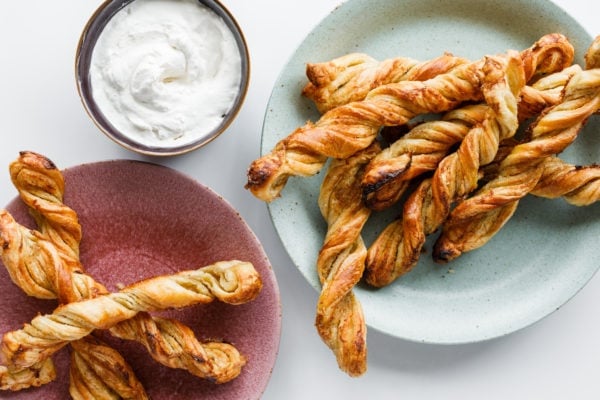 Puff Pastry Orange Twists on plates with cream