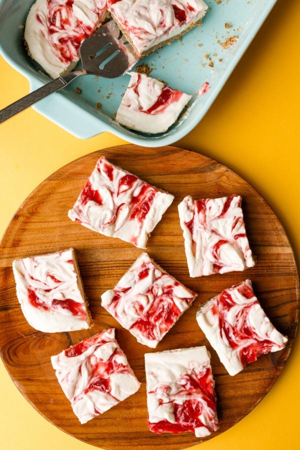 Meyer Lemon Strawberry Bars on wood plate