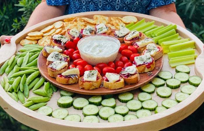 a big board with Strawberry Brie Crostini Appetizer in the center