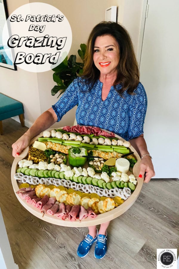 woman holding a round St. Patrick's Day Grazing Board