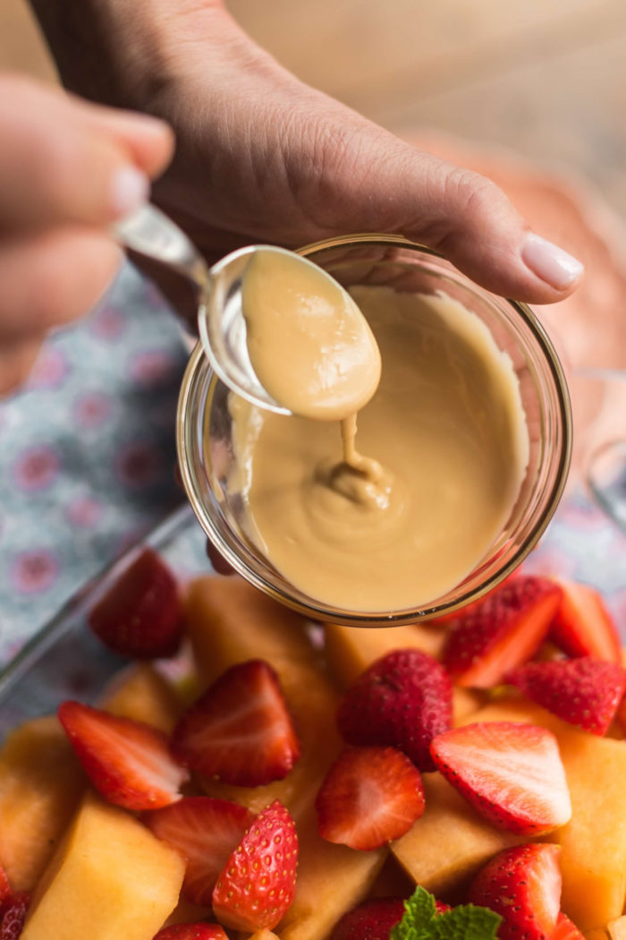 adding a vanilla dressing to Easy Fruit Salad with Vanilla Extract