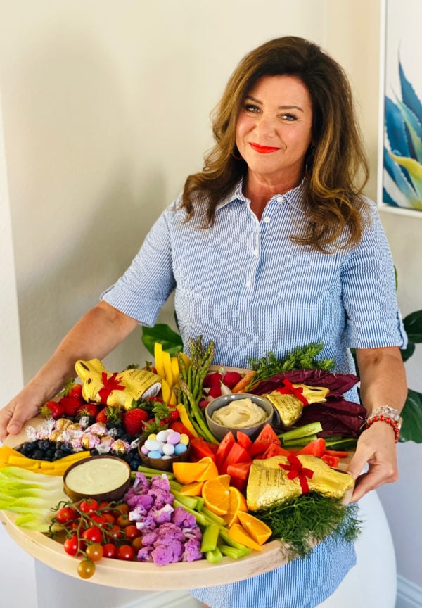 woman holding an Easter crudite board