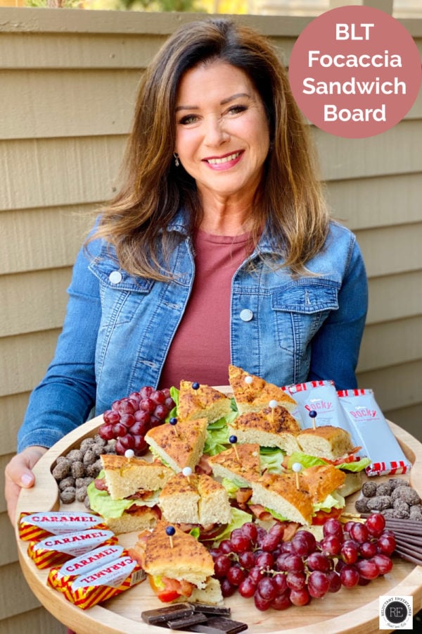 woman holding a BLT Focaccia Sandwich Board