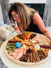 woman and dog with a Dog Charcuterie Board