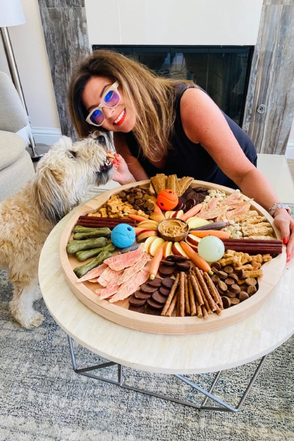 whoodle dog, a woman holding a dog charcuterie board