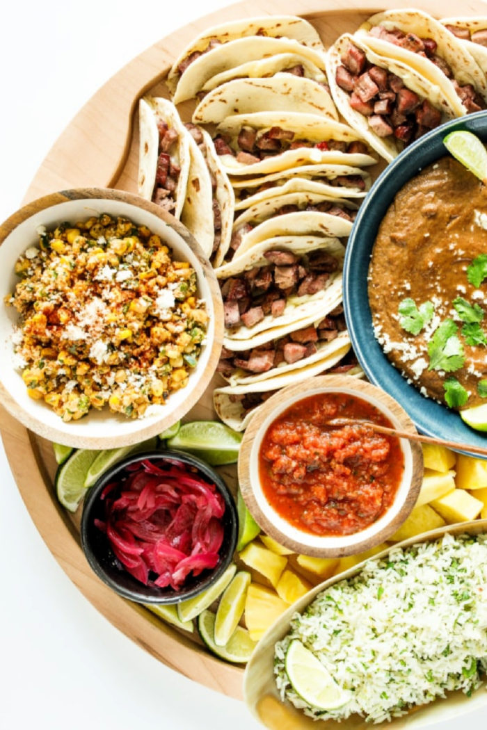 steak tacos with side dishes