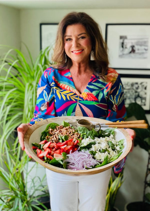 woman holding a Strawberry Spinach Salad