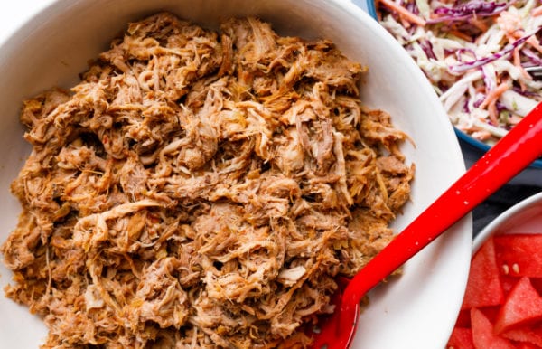 Slow Cooker BBQ Pulled Pork with a red spoon