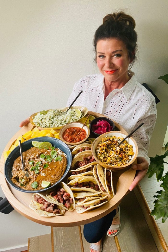 woman holding Taco Charcuterie Board