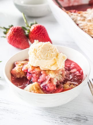 bowl of Best Strawberry Cobbler with ice cream