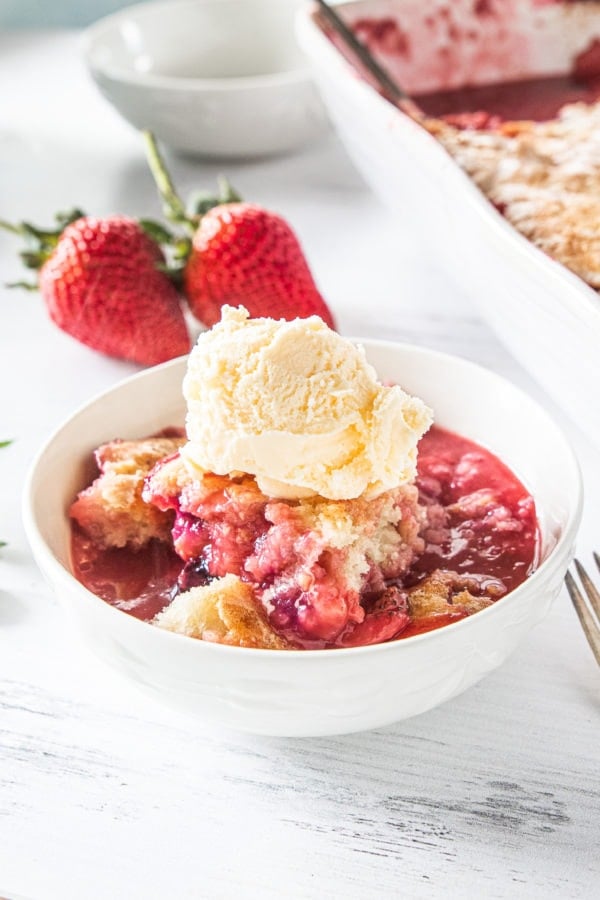 bowl of Best Strawberry Cobbler with ice cream