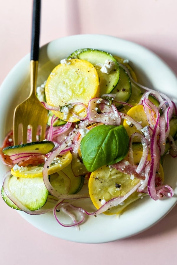 squash salad serving with gold fork
